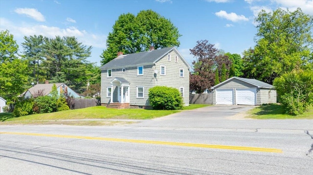 139 S Ave, Lewiston, ME 04240 - colonial inspired home featuring a detached garage, an outbuilding, and a chimney