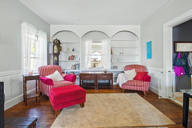 139 S Ave, Lewiston, ME 04240 - sitting room with wood finished floors, plenty of natural light, and built in features