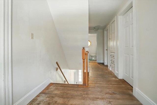 139 S Ave, Lewiston, ME 04240 - hallway with an upstairs landing, wood finished floors, and baseboards