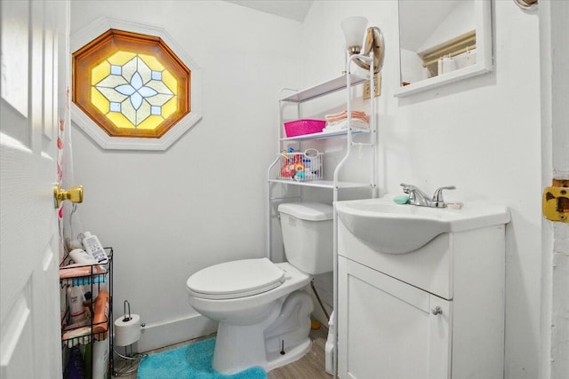 139 S Ave, Lewiston, ME 04240 - half bathroom featuring vanity, toilet, and baseboards