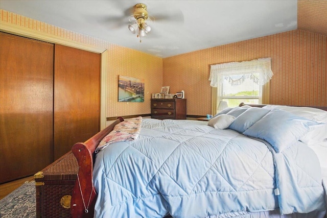 139 S Ave, Lewiston, ME 04240 - bedroom featuring wallpapered walls, vaulted ceiling, a closet, and ceiling fan