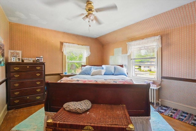 139 S Ave, Lewiston, ME 04240 - bedroom featuring wallpapered walls, wood finished floors, multiple windows, baseboards, and a ceiling fan