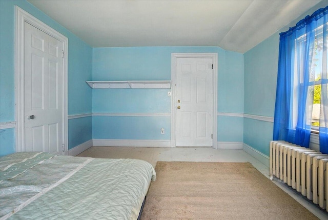 139 S Ave, Lewiston, ME 04240 - bedroom with radiator, lofted ceiling, and baseboards