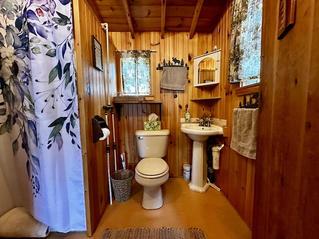 1080 Frenchtown Rd, Frenchtown Twp, ME 04441 - bathroom with wood ceiling with exposed beams, wood walls, toilet, a shower with curtain, and a sink