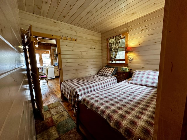 1080 Frenchtown Rd, Frenchtown Twp, ME 04441 - bedroom featuring wooden ceiling, wood-type flooring, wood walls, and multiple windows