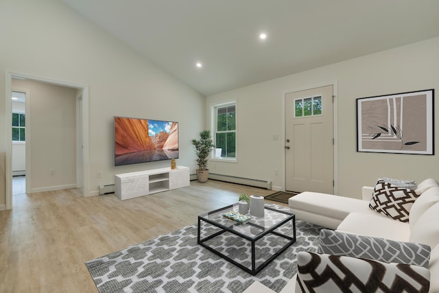 324 Gray Rd, Shapleigh, ME 04076 - living area with a baseboard heating unit, wood finished floors, high vaulted ceiling, recessed lighting, and baseboard heating