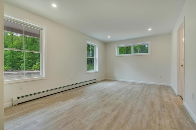324 Gray Rd, Shapleigh, ME 04076 - empty room featuring a baseboard radiator, light wood-style flooring, baseboards, and recessed lighting