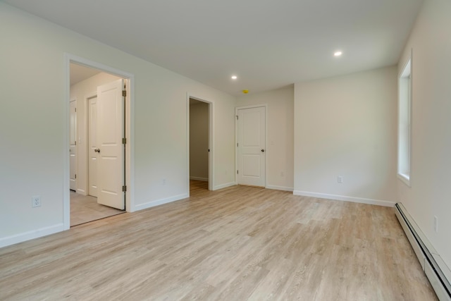 324 Gray Rd, Shapleigh, ME 04076 - spare room with a baseboard heating unit, light wood-style floors, recessed lighting, and baseboards