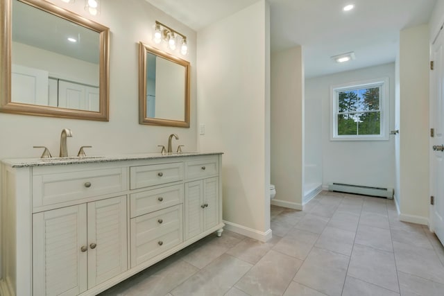 324 Gray Rd, Shapleigh, ME 04076 - full bath featuring a baseboard radiator, toilet, double vanity, baseboards, and recessed lighting