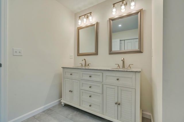 324 Gray Rd, Shapleigh, ME 04076 - full bathroom with baseboards, double vanity, and tile patterned floors
