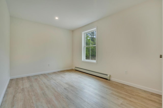 324 Gray Rd, Shapleigh, ME 04076 - empty room with baseboard heating, light wood-type flooring, baseboards, and recessed lighting