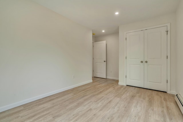 324 Gray Rd, Shapleigh, ME 04076 - unfurnished bedroom with light wood-style flooring, recessed lighting, baseboards, a baseboard heating unit, and a closet