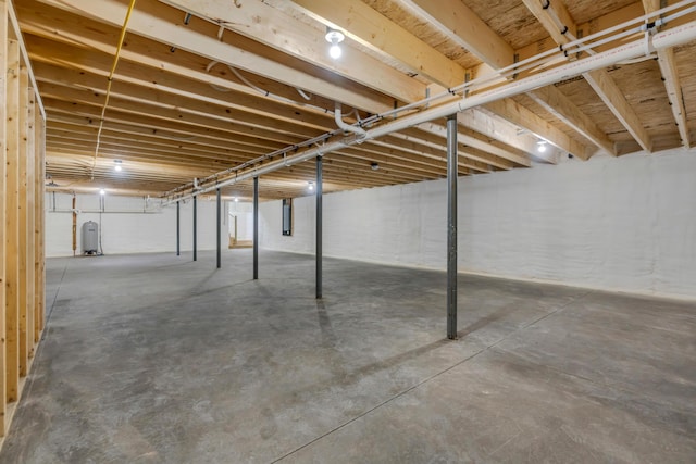 324 Gray Rd, Shapleigh, ME 04076 - unfinished basement featuring electric panel and a water pressure tank