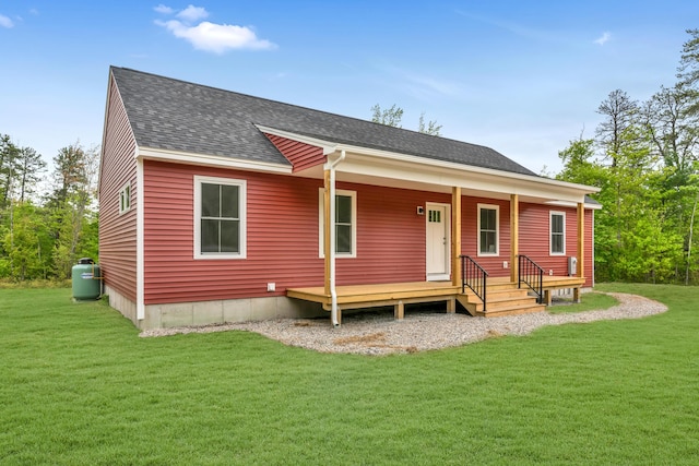 324 Gray Rd, Shapleigh, ME 04076 - back of house featuring roof with shingles, covered porch, and a lawn