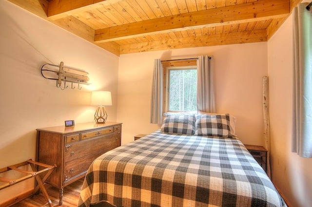 231 Kendall Farm Trl, Rangeley, ME 04970 - bedroom with wooden ceiling, beamed ceiling, and wood finished floors
