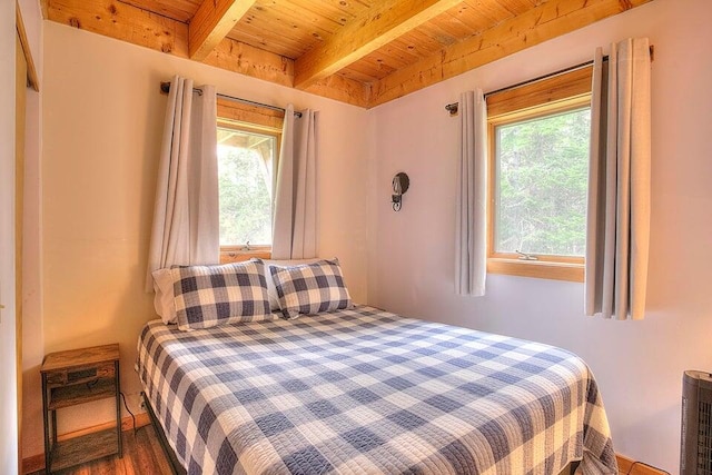 231 Kendall Farm Trl, Rangeley, ME 04970 - bedroom featuring wood ceiling, beamed ceiling, and wood finished floors