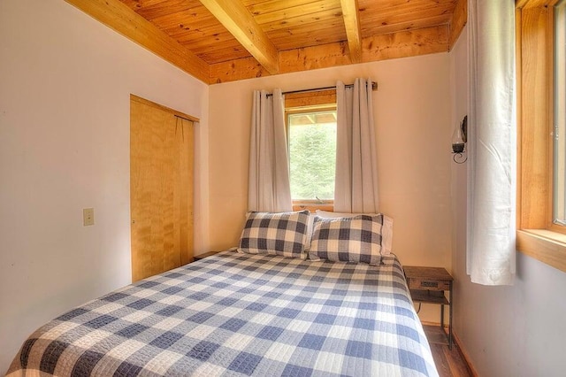 231 Kendall Farm Trl, Rangeley, ME 04970 - bedroom with wood ceiling, beamed ceiling, wood finished floors, and a closet
