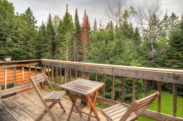 231 Kendall Farm Trl, Rangeley, ME 04970 - wooden deck with a wooded view