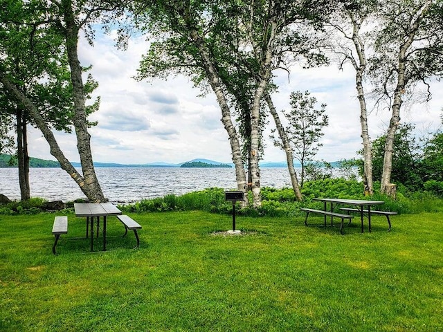 231 Kendall Farm Trl, Rangeley, ME 04970 - view of home's community with a water and mountain view and a yard