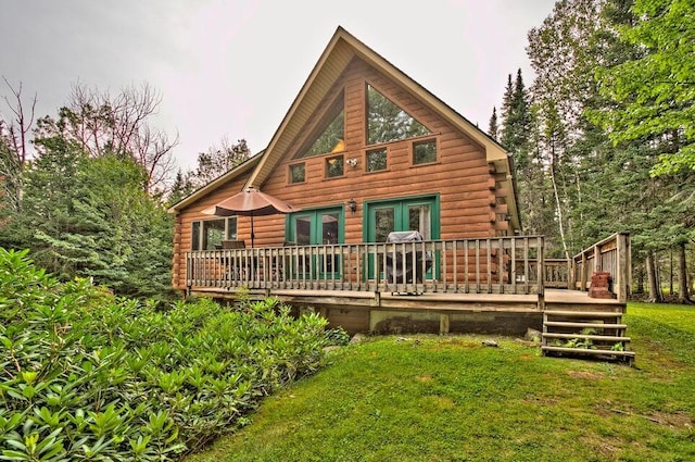231 Kendall Farm Trl, Rangeley, ME 04970 - rear view of property featuring log siding, a wooden deck, and a yard