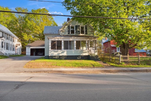 view of front of property with a detached garage