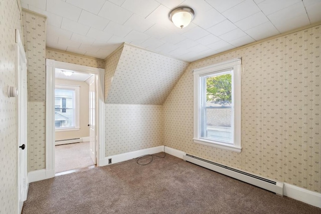 additional living space featuring baseboard heating, carpet, a baseboard radiator, wallpapered walls, and baseboards