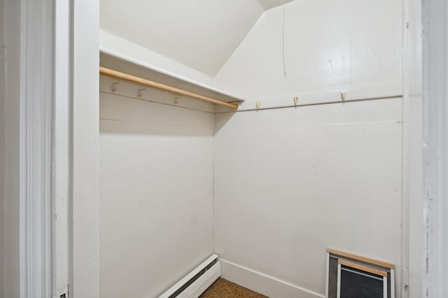 walk in closet featuring vaulted ceiling