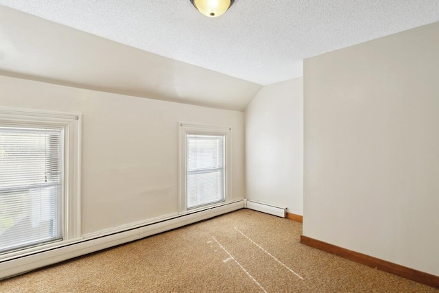 bonus room with a baseboard radiator, carpet, baseboards, and vaulted ceiling