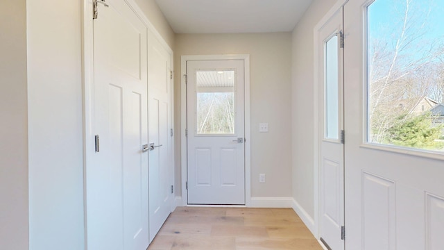 9 Country Dr, Old Orchard Beach, ME 04064 - doorway to outside featuring light wood finished floors and baseboards