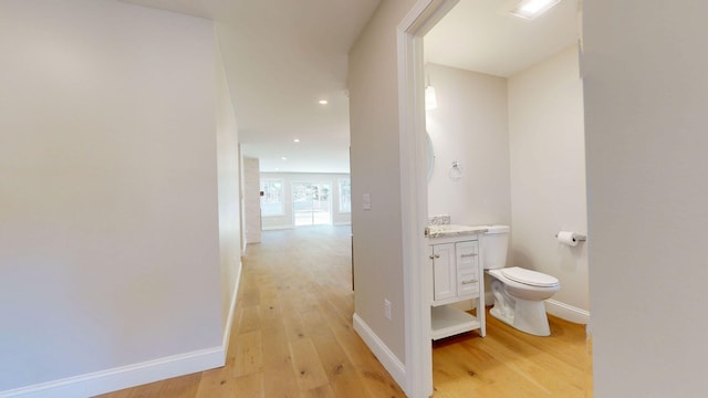 9 Country Dr, Old Orchard Beach, ME 04064 - bathroom with wood finished floors, toilet, baseboards, vanity, and recessed lighting