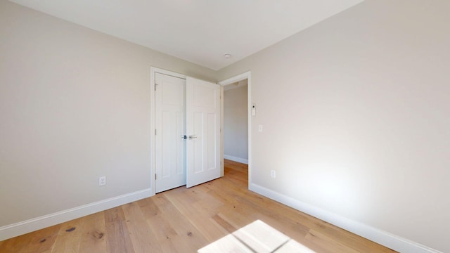 9 Country Dr, Old Orchard Beach, ME 04064 - empty room with baseboards and light wood-style flooring