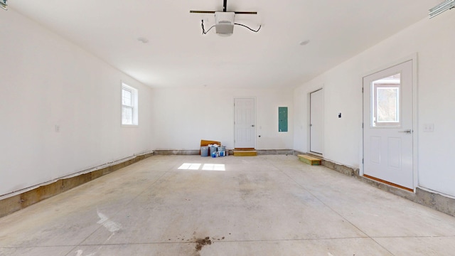 9 Country Dr, Old Orchard Beach, ME 04064 - garage featuring electric panel and a garage door opener