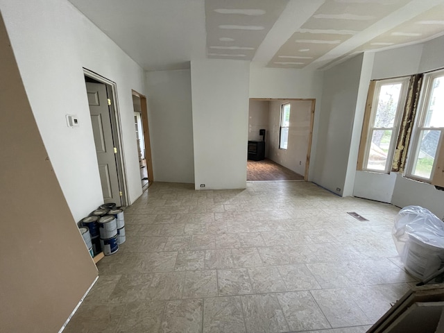 172 Highland Ave, Gardiner, ME 04345 - empty room featuring healthy amount of natural light and stone tile floors
