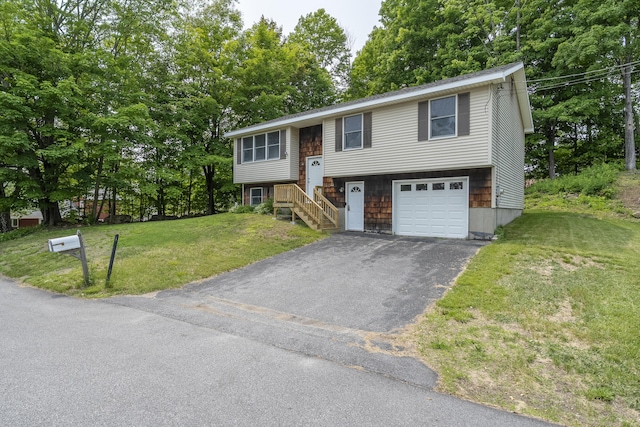 32 Thorne Ave, Lewiston, ME 04240 - split foyer home featuring driveway, a front lawn, an attached garage, and view of wooded area