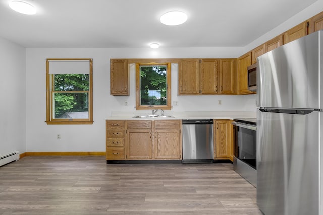 32 Thorne Ave, Lewiston, ME 04240 - kitchen with appliances with stainless steel finishes, light countertops, and healthy amount of natural light