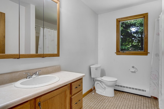 32 Thorne Ave, Lewiston, ME 04240 - full bath featuring a baseboard heating unit, vanity, baseboards, toilet, and tile patterned floors