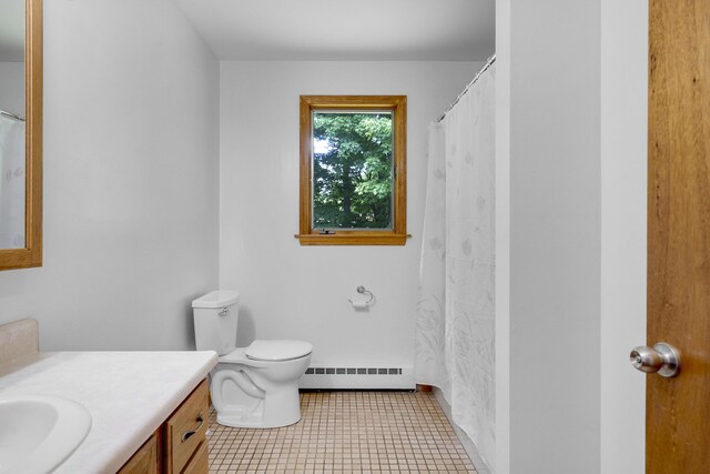 32 Thorne Ave, Lewiston, ME 04240 - full bath with a baseboard heating unit, vanity, and toilet