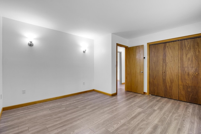 32 Thorne Ave, Lewiston, ME 04240 - unfurnished bedroom featuring light wood finished floors, baseboards, and a closet