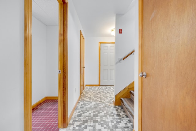 32 Thorne Ave, Lewiston, ME 04240 - corridor with baseboards and stairs
