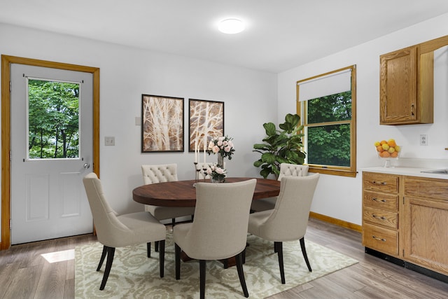 32 Thorne Ave, Lewiston, ME 04240 - dining room featuring light wood finished floors and baseboards