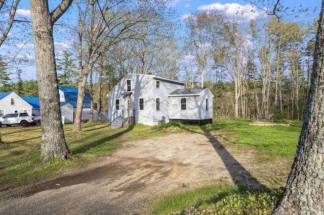 441 Middle Rd, Woolwich, ME 04579 - view of front of property featuring a front yard and dirt driveway