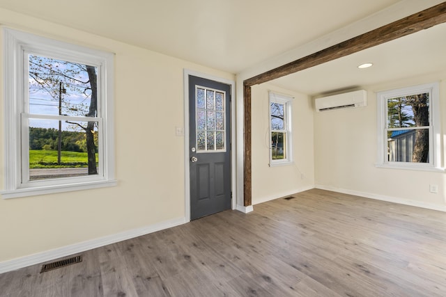 441 Middle Rd, Woolwich, ME 04579 - foyer with a wall mounted AC, healthy amount of natural light, and baseboards