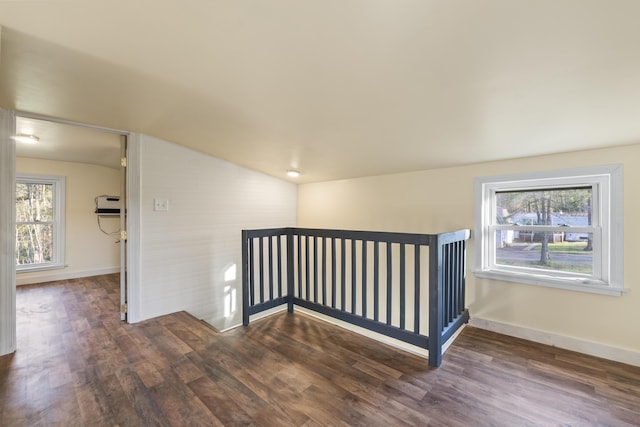 441 Middle Rd, Woolwich, ME 04579 - corridor featuring wood finished floors, plenty of natural light, lofted ceiling, baseboards, and an upstairs landing