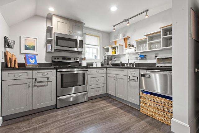 66 Spruce St Unit 1, Portland, ME 04102 - kitchen with open shelves, appliances with stainless steel finishes, dark countertops, a sink, and recessed lighting
