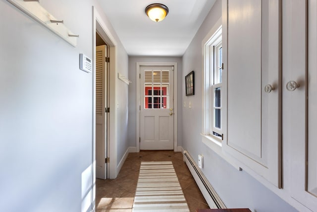 18 Laurel Ln, Eliot, ME 03903 - doorway to outside featuring baseboard heating, light tile patterned floors, and baseboards