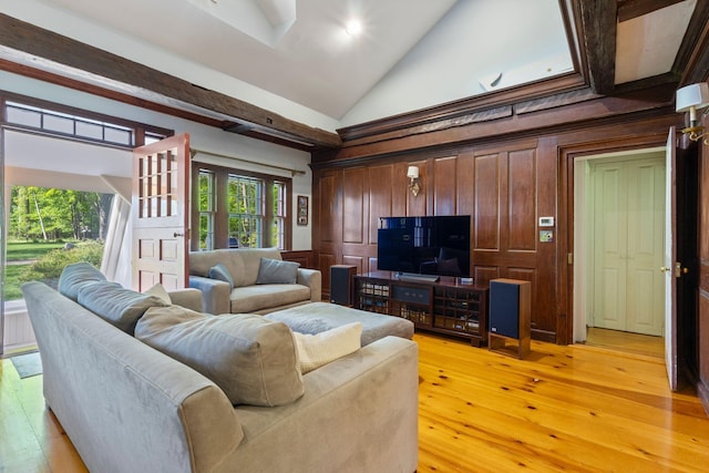 18 Laurel Ln, Eliot, ME 03903 - living area featuring light wood-style floors, high vaulted ceiling, and wood walls