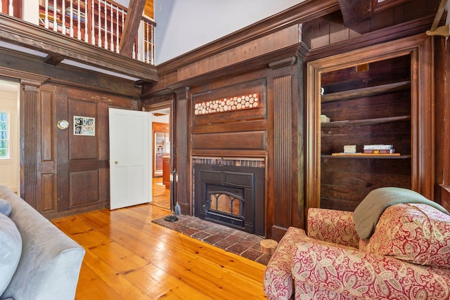 18 Laurel Ln, Eliot, ME 03903 - living room with wooden walls, hardwood / wood-style flooring, and a fireplace