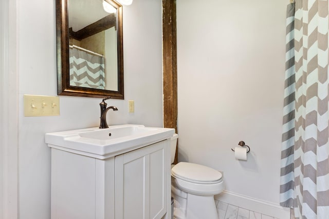 18 Laurel Ln, Eliot, ME 03903 - full bathroom with marble look tile flooring, vanity, toilet, a shower with shower curtain, and baseboards
