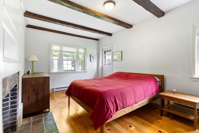 18 Laurel Ln, Eliot, ME 03903 - bedroom with a baseboard radiator, beam ceiling, and wood finished floors
