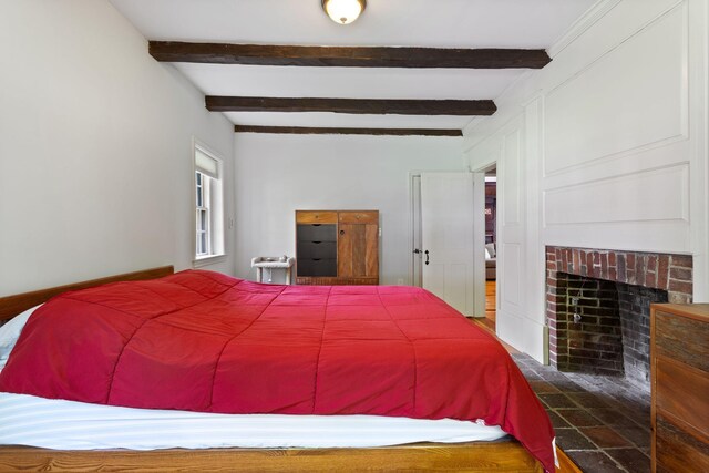 18 Laurel Ln, Eliot, ME 03903 - bedroom with beamed ceiling and a fireplace